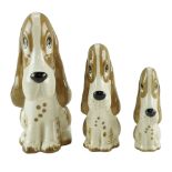 Three Szeiler comical dog figurines, tallest 13 cm