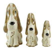 Three Szeiler comical dog figurines, tallest 13 cm