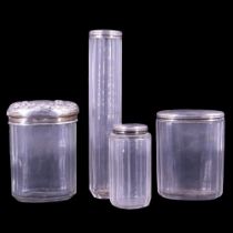 Three matching Victorian silver-mounted facet-cut glass toiletry / dressing vessels together with