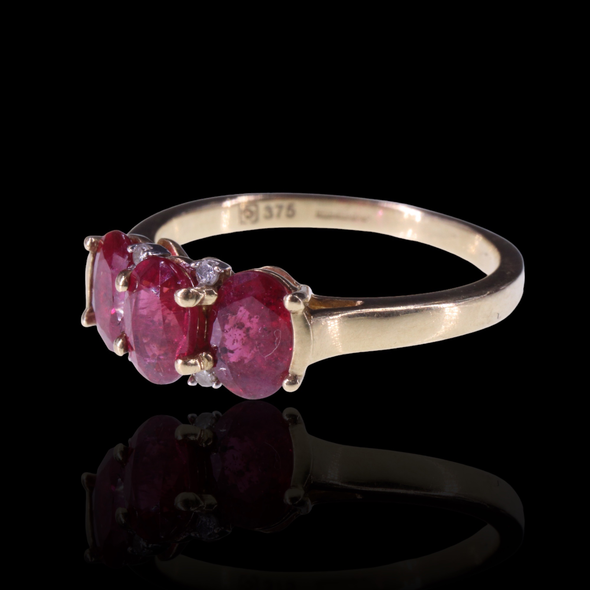 A three-stone natural ruby ring, comprising three oval cut stones each of approx 0.6 ct, bar-and - Image 6 of 9