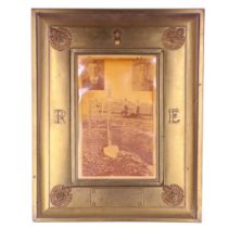 A large Great War In Memoriam photograph frame, in sheet brass faced with Royal Engineers insignia