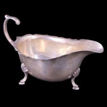 A 1930s silver sauce boat, of Georgian form with flying scroll handle, TS, Birmingham, 1933, 79 g
