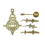 A small group of vintage domestic brassware including a trivet and two novelty nut crackers,