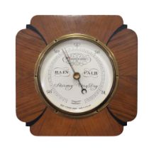 An Art Deco aneroid barometer by Short & Mason of London, in an ebonised and walnut case, 21.5 x