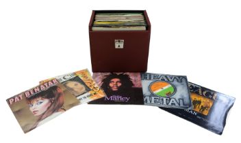 Cased single records including Bob Marley, The Human League, Communards, The Sex Pistols, Madness