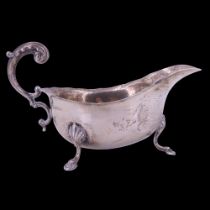 A Georgian-shape silver sauce boat, having an acanthus-capped open scroll handle, S Blanckensee &