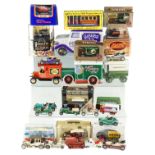 A group of advertising tins and diecast vans including a ceramic Carlton Ware Harrods van, a