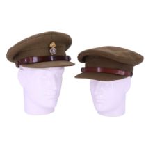 Two George VI army officers' Service Dress caps, one bearing a Northumberland Fusiliers cap badge