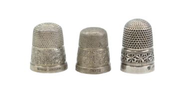 Three early 20th Century silver / white metal thimbles