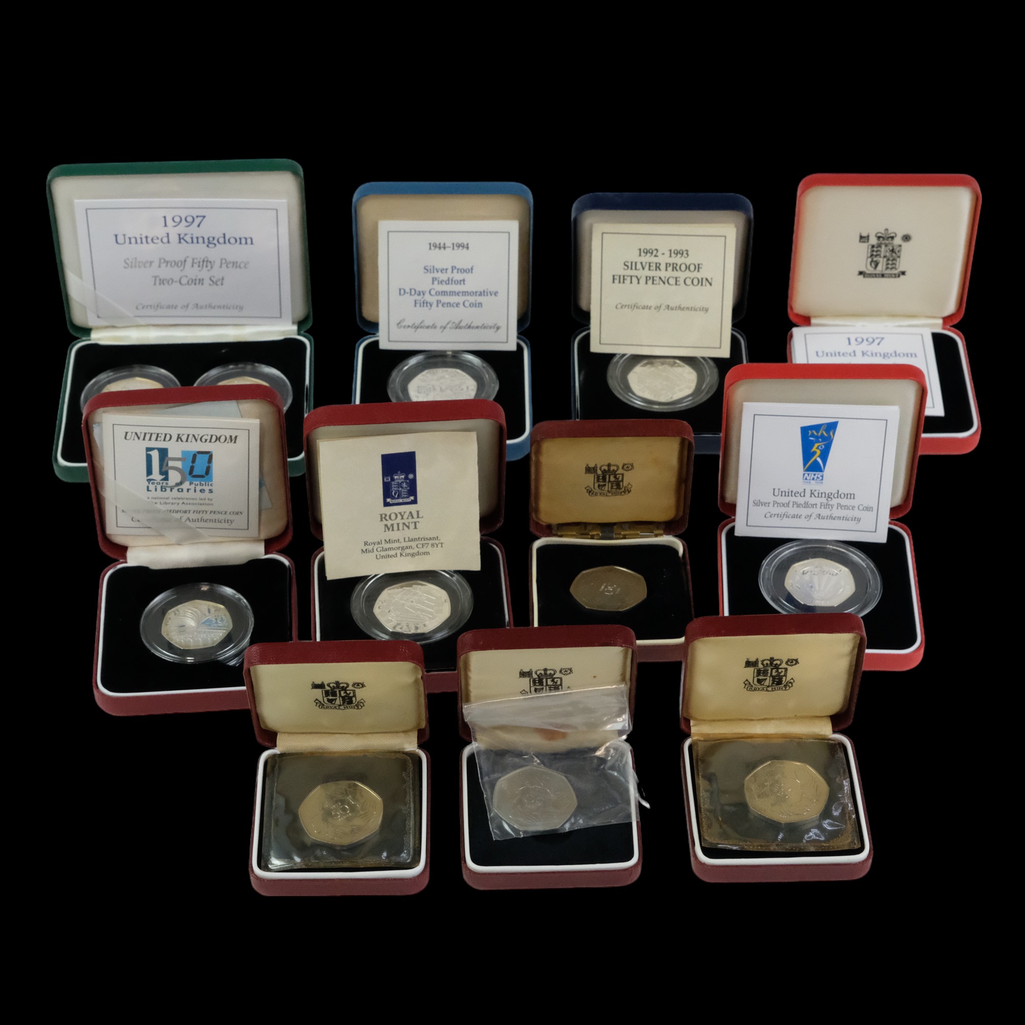 A group of Royal Mint silver proof fifty pence coins, including a 1994 Piedfort D-Day Commemorative,