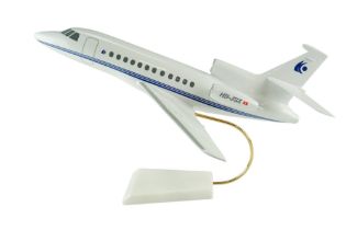 A large scale model Dassault Falcon 900 corporate trijet aircraft and marble stand, injection-