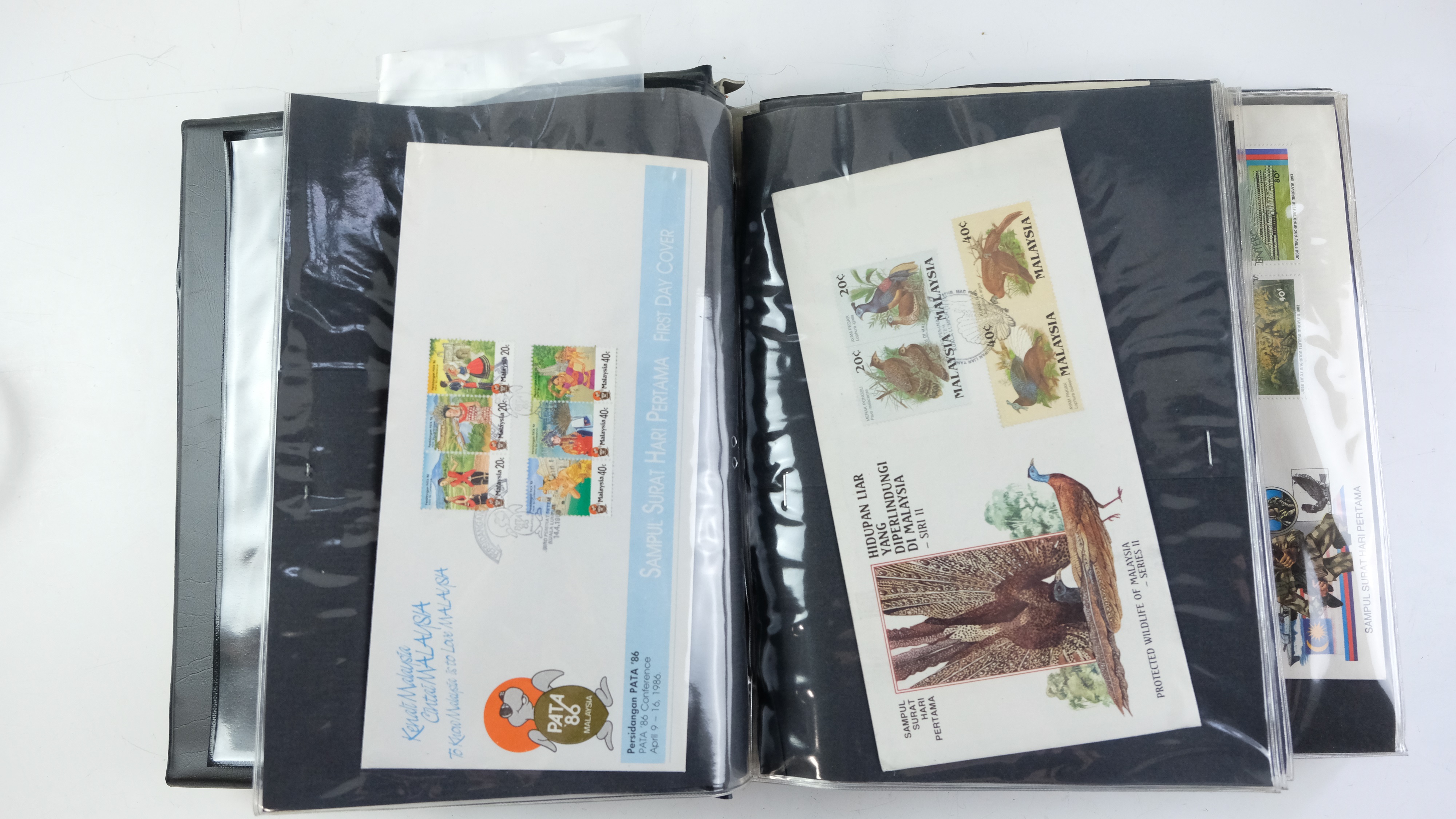 A large quantity of albums containing various world stamp covers including royal commemoratives, - Image 146 of 154