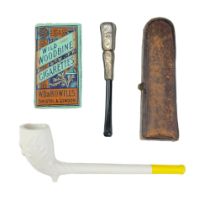 An early 20th Century cased silver-collared meerschaum and amber cigar holder, together with Europen