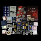 Two coin sets comprising "Winston Churchill Inspiration to a Nation" and "A War To End All Wars",