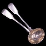 A pair of Victorian silver fiddle pattern sauce ladles, Henry Holland (of Holland, Aldwinckle &