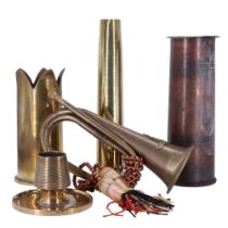 Two trench art shell case vases, a 1939 dated 38-mm Bofors anti-aircraft gun shell case, a brass