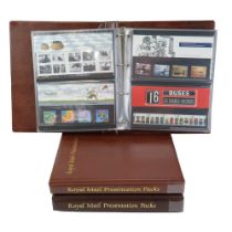 Three albums of Royal Mail commemorative Mint Stamp packs