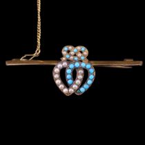 An antique romantic turquoise and pearl bar brooch, being a pair of interlocking hearts surmounted