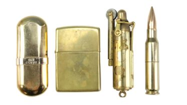 A Zippo brass flip-top petrol cigarette lighter together with a Brass No 6 and two trench art