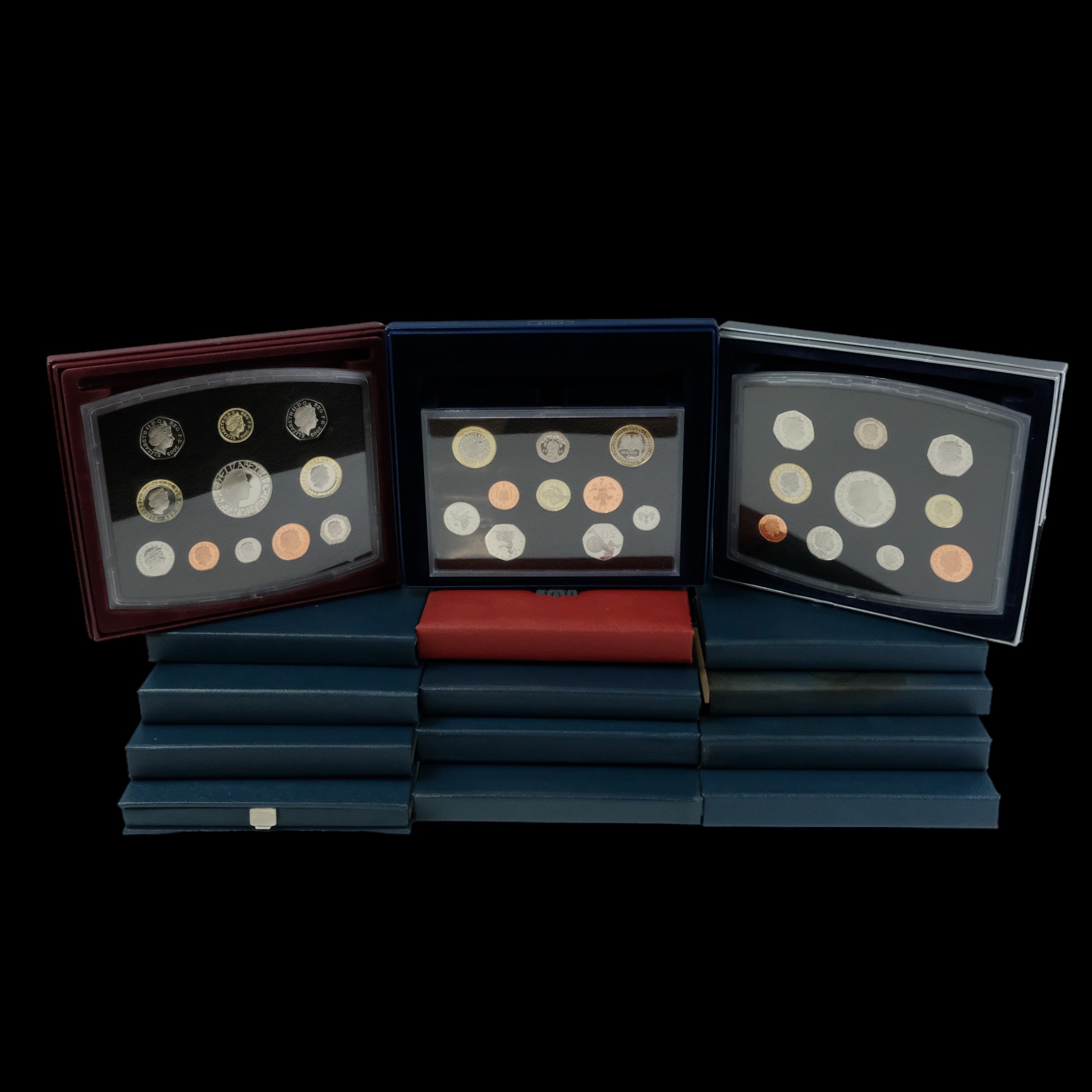 A collection of Royal Mint proof year coin sets, 1985-2004, (lacking four years)