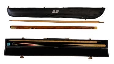 A cased Riley snooker cue together with a Reydon Alpine cue