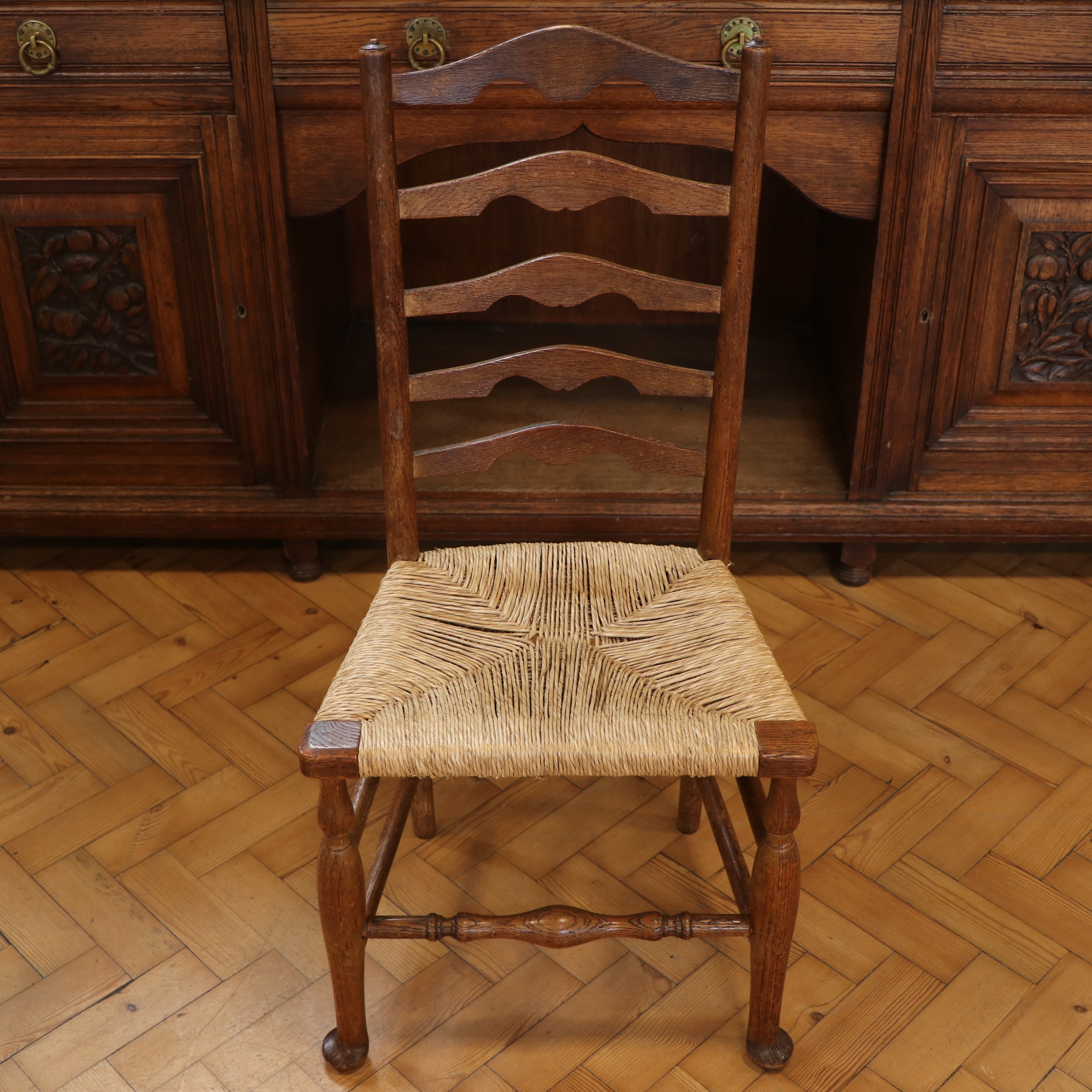 Four late 19th / early 20th Century rush-seated oak ladder-back chairs, 95 cm - Image 3 of 3