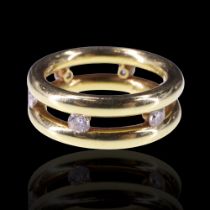 A striking contemporary diamond and 18 ct gold finger ring, comprising six diamond brilliants of