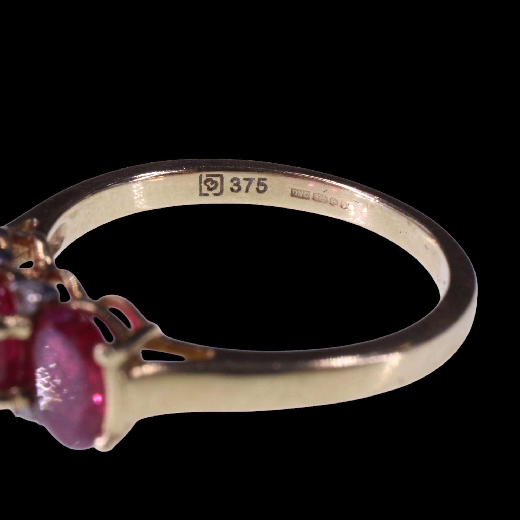 A three-stone natural ruby ring, comprising three oval cut stones each of approx 0.6 ct, bar-and - Image 9 of 9