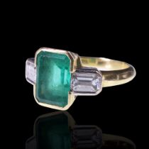 An impressive Art Deco style emerald and diamond ring, comprising a large emerald-cut stone of
