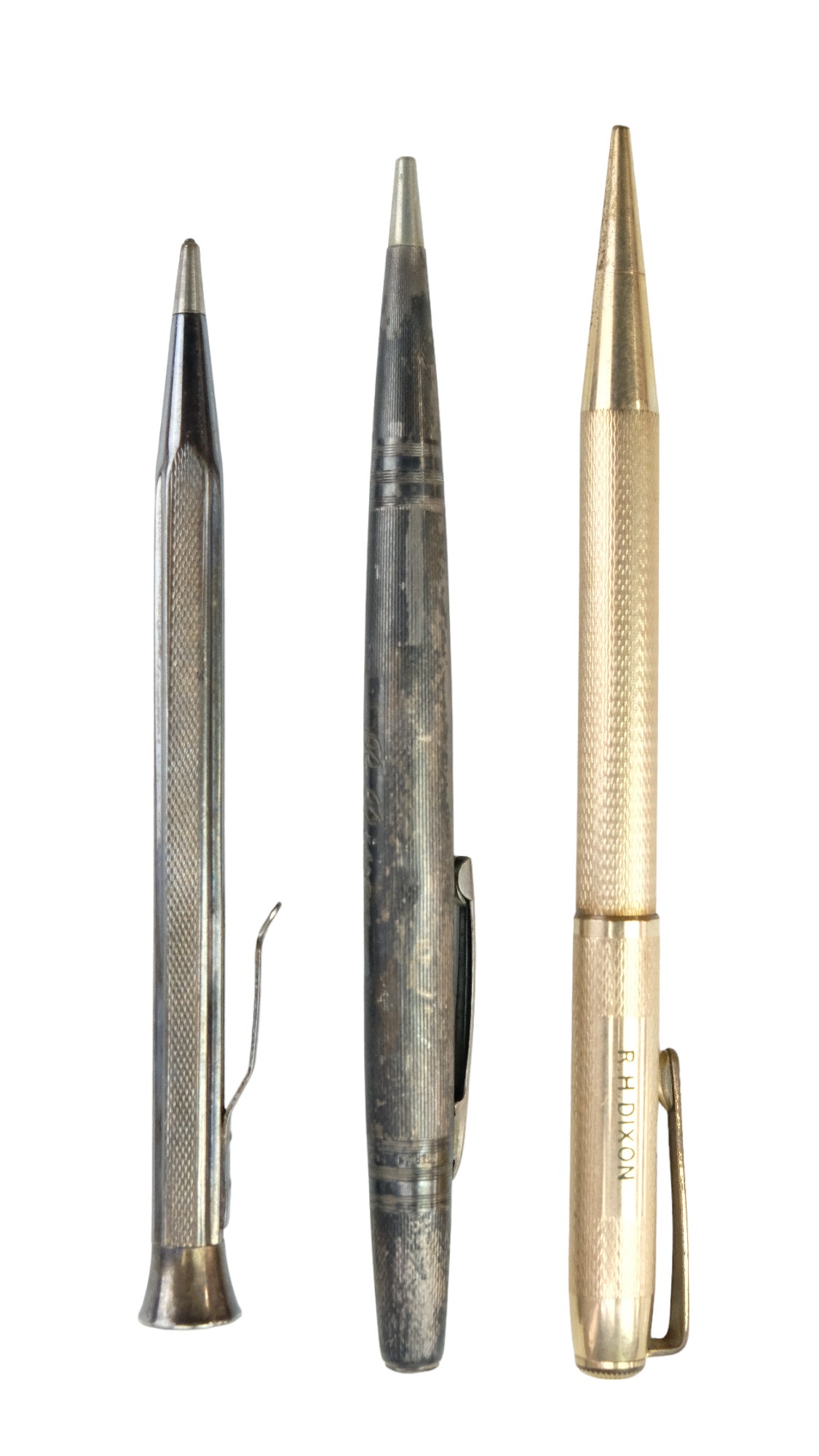 Three vintage propelling pencils comprising two white metal examples (marked "900" and "STERLING