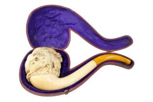 A fine antique meerschaum pipe, its bowl high-relief-carved in depiction of horses fleeing hounds,