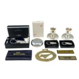 A group of British Airways Concorde collectables including two candlesticks, key rings, playing
