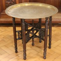 An early-to-mid 20th Century Egyptian brass-topped folding table, 59 cm x 54 cm