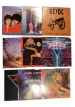 A quantity of vinyl records including Gary Moore, Phil Lynott, Quireboys, AC/DC, etc