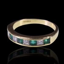 An emerald and diamond half-hoop eternity ring, comprising five square-cut emeralds divided by