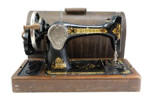 A 1928 US Singer hand-cranked sewing machine in wooden case, serial number Y6207172