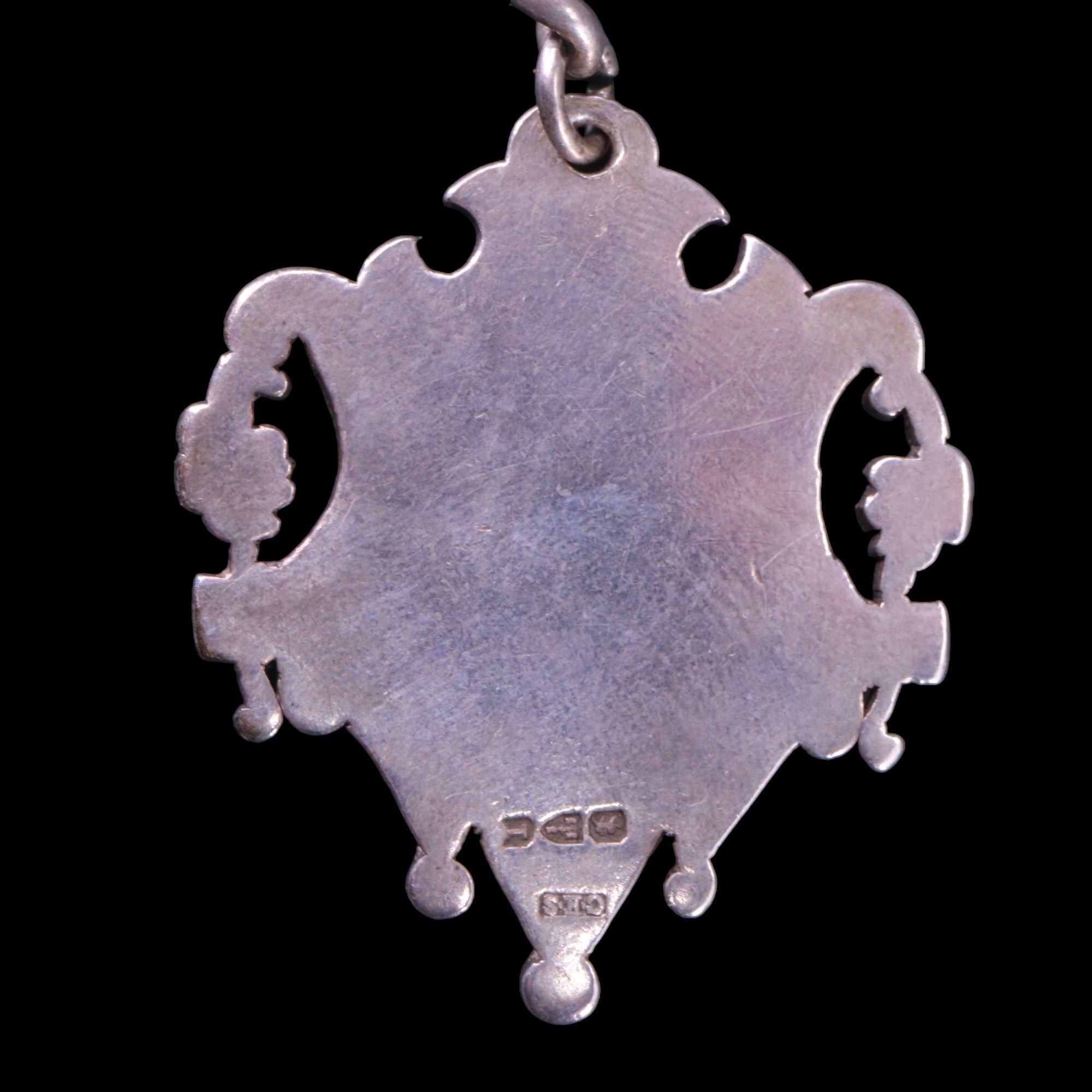 An Edwardian silver curb-link watch chain having a vacant Victorian open-work fob medallion, - Image 2 of 2