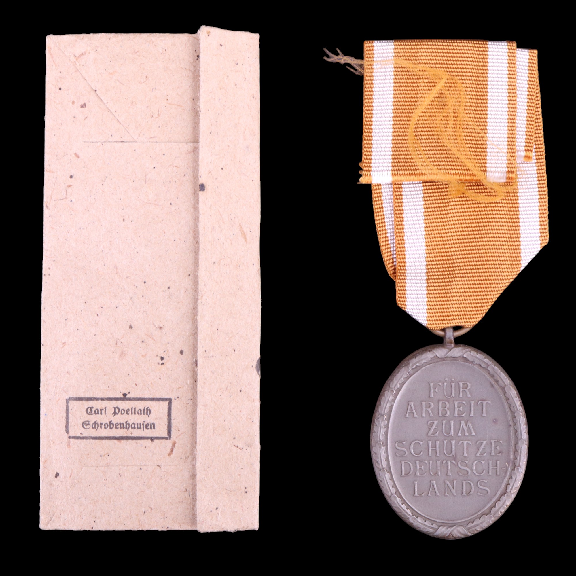 A German Third Reich West Wall medal and packet - Image 2 of 2