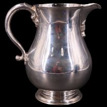 A large Georgian-style silver baluster water or ale jug by Payne & Son of Oxford, London, 1973, 20