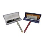 Three vintage fountain pens comprising a cased Sheaffer and two Mentmore Supreme',s together with