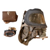 A Second World War baby's gas mask together with a civilian respirator in commercial fibre case