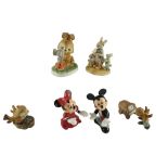 Six nursery ceramic figurines comprising Disney Mickey and Minnie Mouse, bisque birds and rabbits,