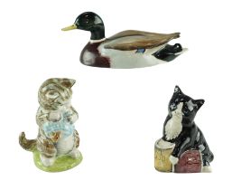 Two Beswick figurines comprising a Mallard duck and Beatrix Potter Miss Moppet together with a Royal