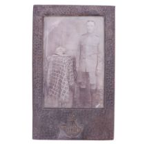 An early 20th Century faux-planished anodized photograph frame faced with a Durham Light Infantry