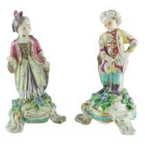 A pair of mid-to-late 18th Century Bow porcelain figurines of a Turkish boy wearing a turban and