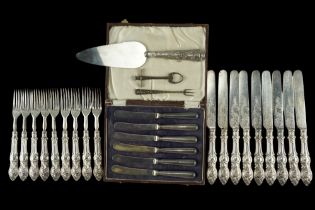 A Victorian set of nine silver-handled fruit forks with knives, together with a cased set of