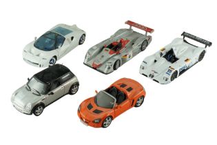 Five Maisto diecast model cars including a Mini Cooper, a Ford G100, etc, 1:18 scale