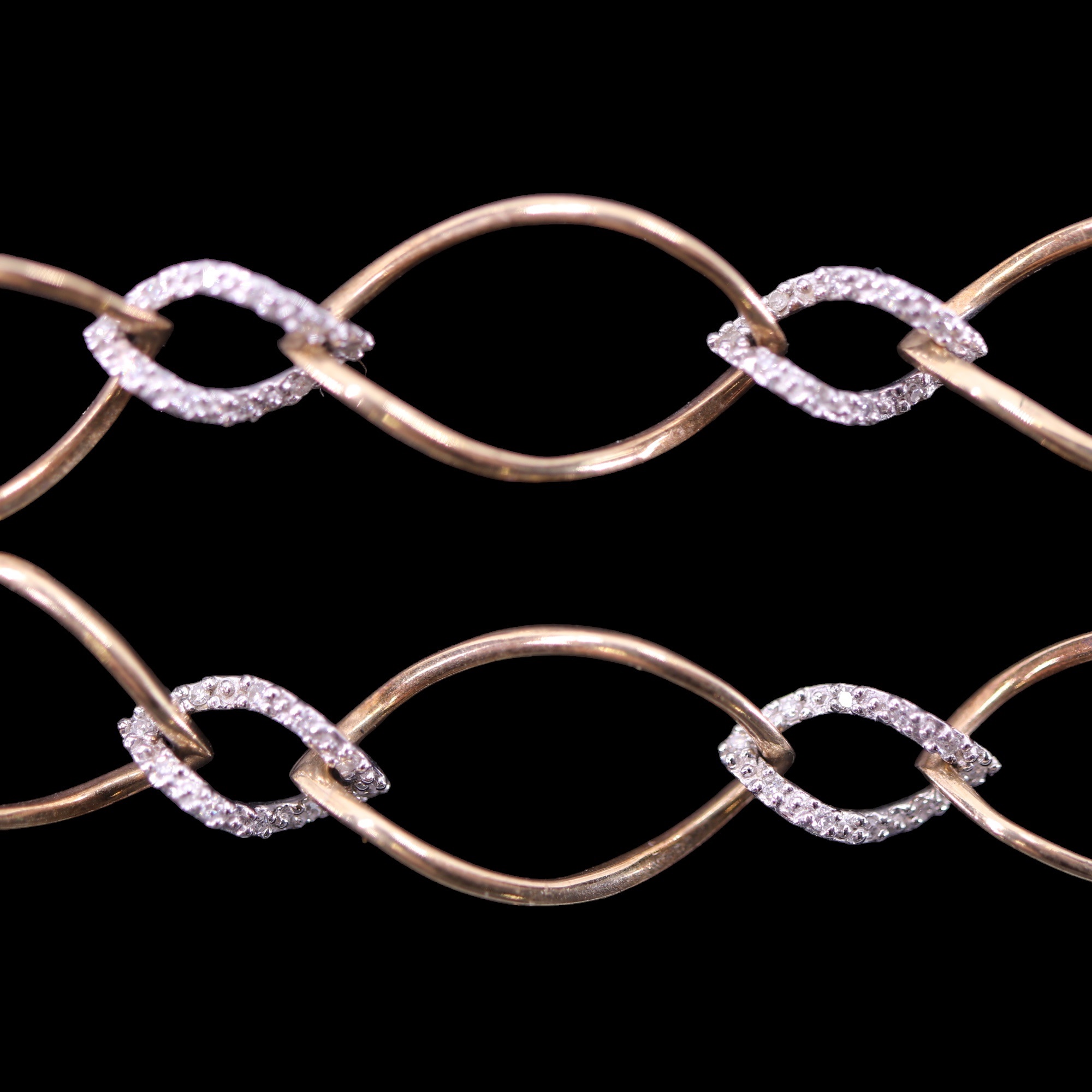 A contemporary two-colour 9 ct gold and diamond bracelet, of large open yellow gold wire curb - Image 4 of 4