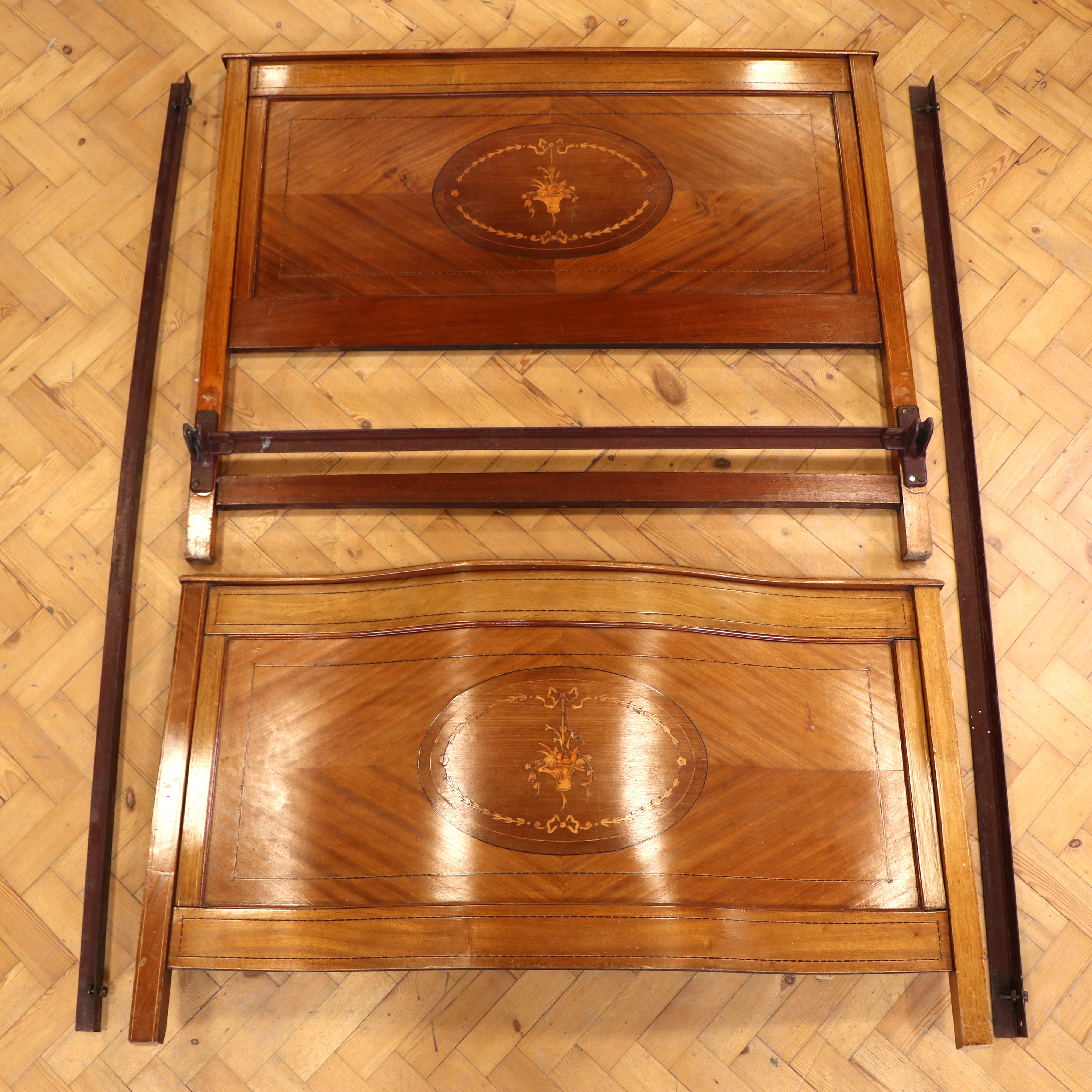 A Sheraton Revival marquetry-inlaid mahogany 4' 6" bedstead, with rails and base, (rails 6' 4"
