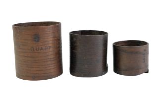 An early 20th Century three-piece bent-wood nested trio of measures, comprising a quart, pint and